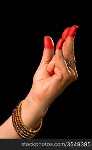 Woman hand showing Kangula hasta (hand gesture, also called mudra) (meaning &acute;Tail&acute;) of indian classic dance Bharata Natyam. Also used in other indian classical dances Kuchipudi and Odissi.