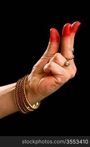 Woman hand showing Kangula hasta (hand gesture, also called mudra) (meaning &acute;Tail&acute;) of indian classic dance Bharata Natyam. Also used in other indian classical dances Kuchipudi and Odissi.