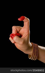 Woman hand showing Tamrachuda hasta (hand gesture, also called mudra) (meaning &acute;rooster&acute;) of indian classic dance Bharata Natyam. Also used in other indian classical dances Kuchipudi and Odissi.