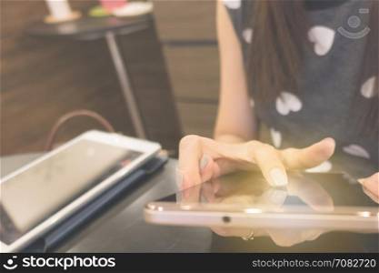 woman hand use mobile phone for internet connection or shopping online and reading at workplace, can use as background