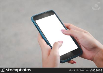 woman hand using a mobile phone mock up a blank screen.