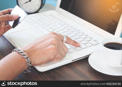 Woman hand using laptop computer and holding credit card, Online shopping