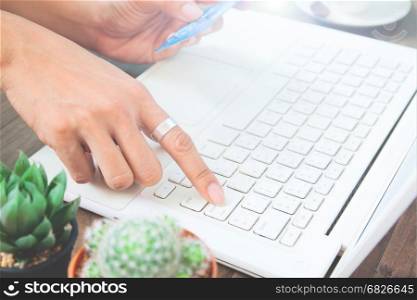 Woman hand using laptop computer and holding credit card, Online shopping