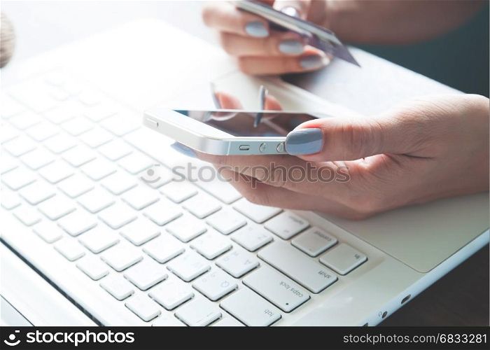 Woman hand using mobile device and credit card, Online shopping and marketing concept