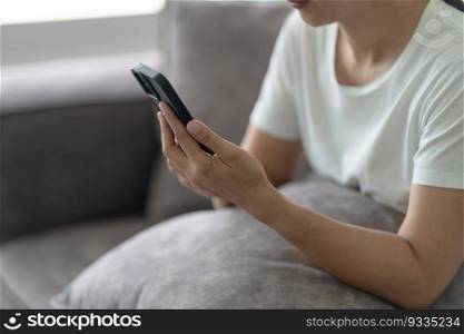Woman hand using smartphone for checking social media or  woman reading ebook on screen