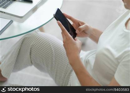 Woman hand using smartphone for checking social media or  woman reading ebook on screen