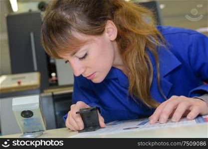 woman hand using stamper on document