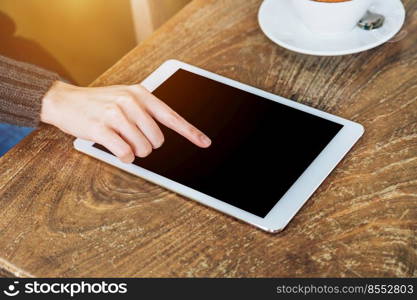 Woman hand writing notebook and phone, tablet on table in garden at coffee shop with vintage toned.