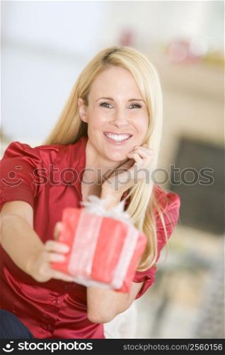 Woman Handing Out Christmas Present