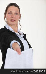 Woman handing over paperwork