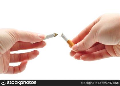 woman hands breaking a cigarette over white background