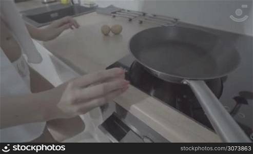 woman hands cooking eggs