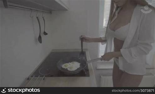 woman hands cooking eggs