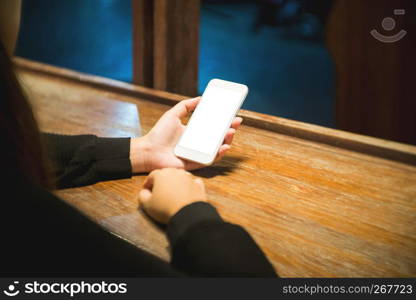 woman hands hold smart phone with empty white blank screen