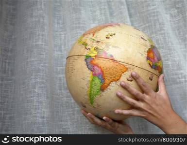 woman hands holding a world globe detail