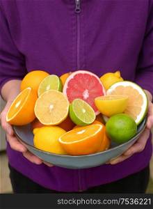Woman Hands Holding Assorted Citrus Fruit