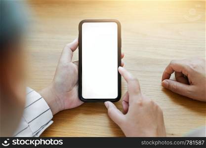 Woman hands holding blank screen mobile phone.