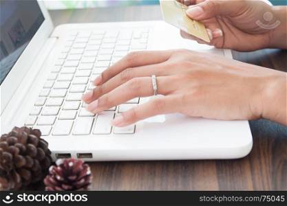 Woman hands holding credit card and using laptop, Online payment
