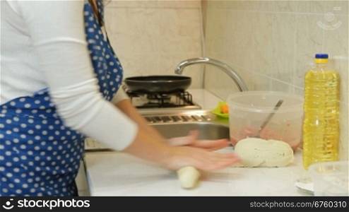 Woman Hands Kneading Stiff Dough For Meat Pie In The Kitchen