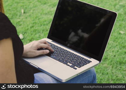 woman hands on a laptop
