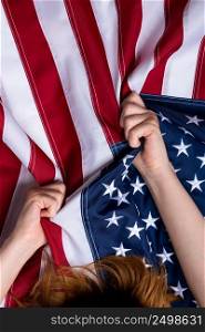 Woman hands pull USA american United States flag concept