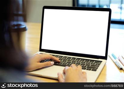 Woman hands typing laptop computer with blank screen for mock up template background, top view, people business technology and lifestyle background concept