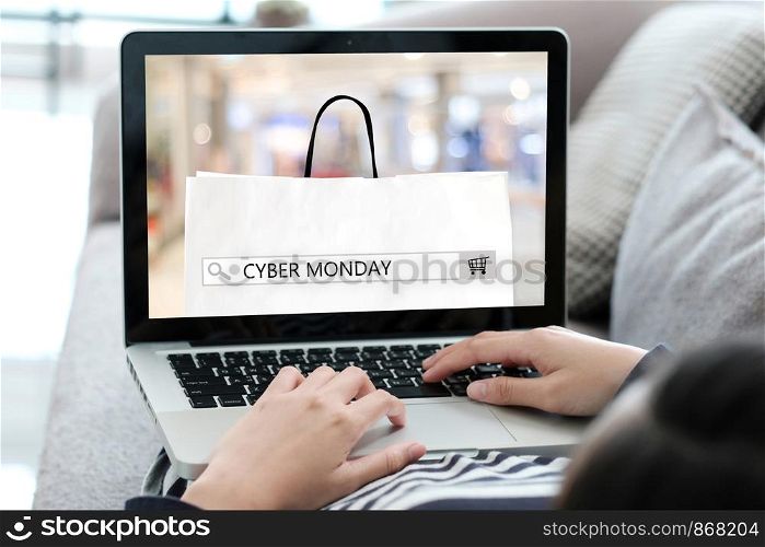 Woman hands typing laptop computer with cyber monday sale on search bar banner background, Online shopping, business and technology