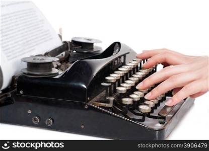 Woman hands typing on vintage typewriter isolated on white