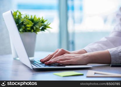 Woman hands working on computer at desk