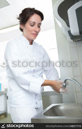 woman handwashing sinks