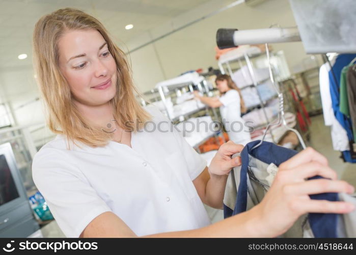 woman hanging a top