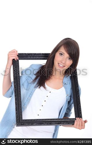woman hanging frame