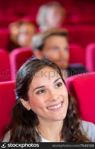 woman happy having fun at theatre or cinema