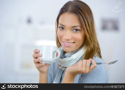 Woman having a coffee at home