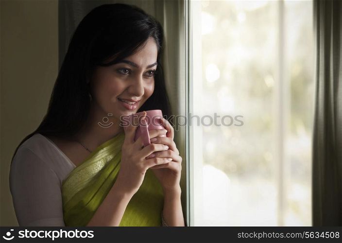 Woman having a cup of coffee