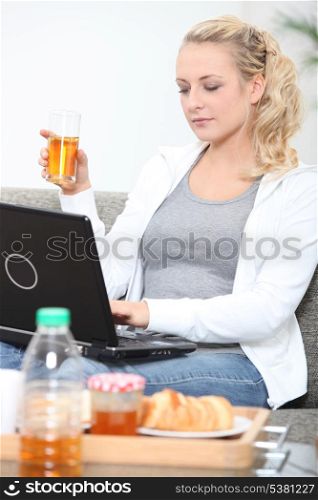 Woman having a glass of apple juice
