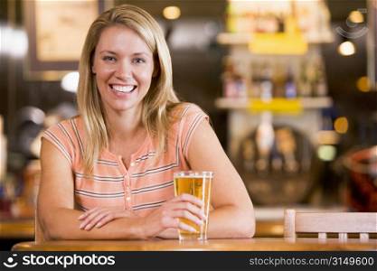Woman having a glass of beer