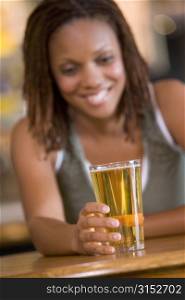 Woman having a glass of beer
