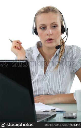 Woman having a hands-free telephone conversation