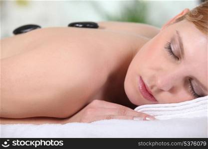 woman having a massage in a spa center