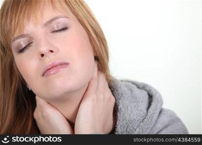 Woman having a neck ache