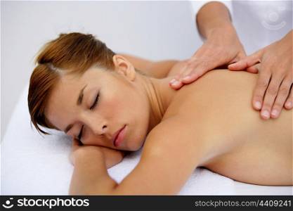 Woman having a soothing back massage