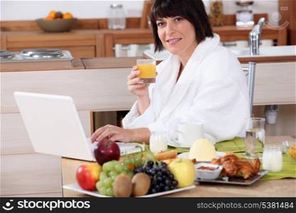 Woman having breakfast in the kitchen