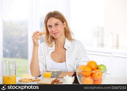 Woman having breakfast in the morning