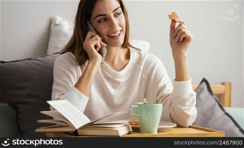 woman having breakfast talking phone home