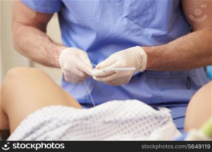 Woman Having Eggs Removed As Part Of IVF Treatment