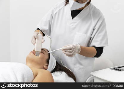 woman having facial skincare treatment