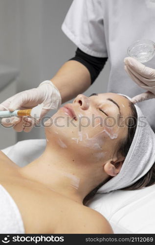 woman having facial treatment