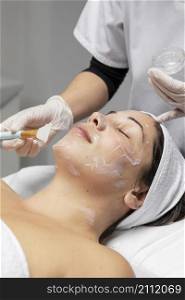 woman having facial treatment