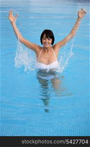 Woman having fun in a swimming pool